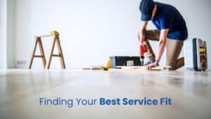 A professional handyman in Katy using a power drill to assemble furniture in a residential home.