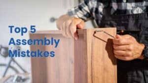 Furniture Assembly Katy. A close-up of misaligned wooden furniture panels and a stripped screw hole, with an orange banner reading "5 COMMON FURNITURE ASSEMBLY MISTAKES."